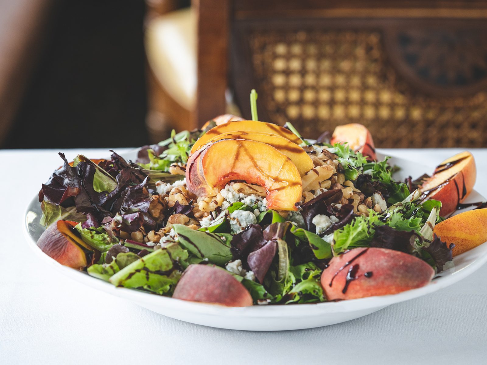 NJ Peach Salad - Mixed greens, bleu cheese, walnuts, NJ peaches & warm port wine dressing - Prepared by Robin’s Nest Mount Holly